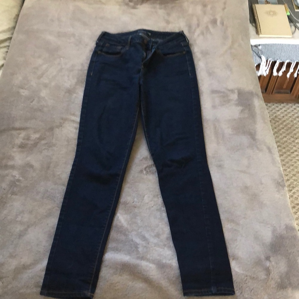 Dark wash, high waisted skinny jeans. Size 6.